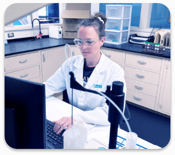 A person in a lab using a computer